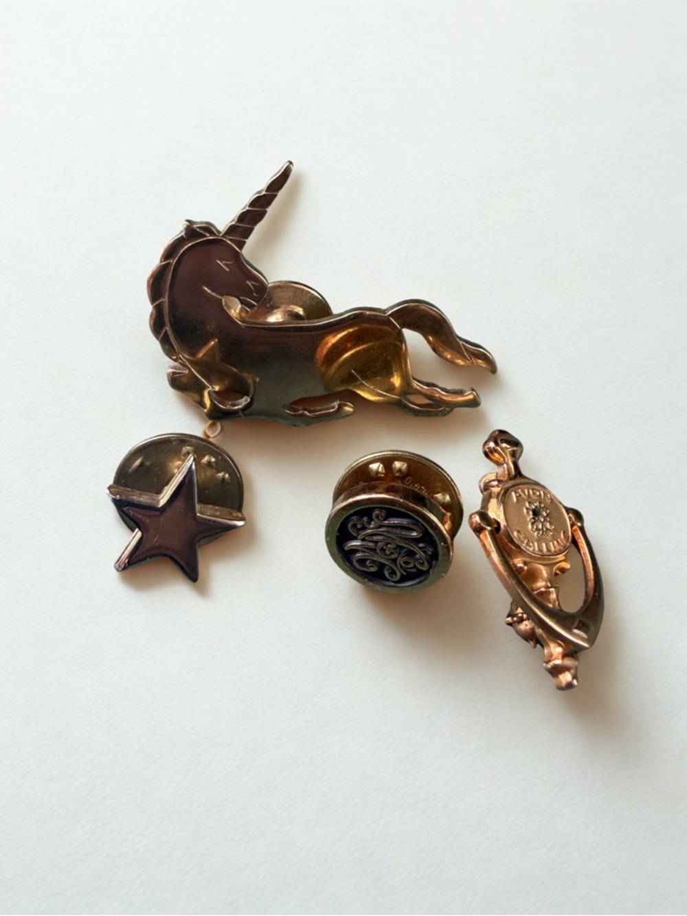 Vintage Avon and other Gold-Tone Lapen Pins